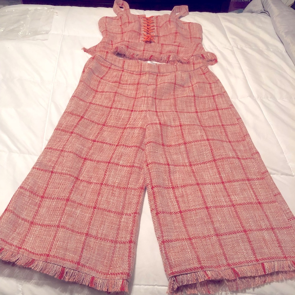 Lace up tweed top and wide leg tweed pants.